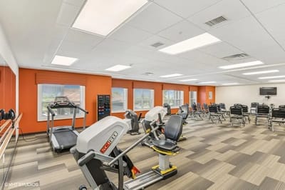 Well-equipped exercise room with various machines
