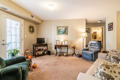 A cozy interior common area with comfortable seating
