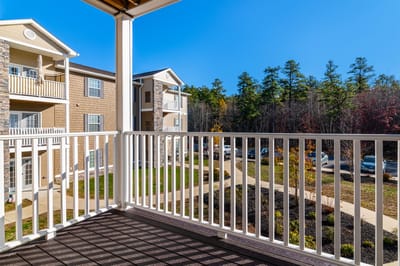 View from a balcony overlooking the landscaping and parking area