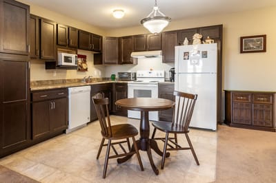 Cozy kitchen area with a table and chairs