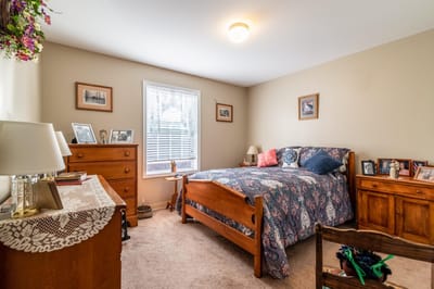 Cozy private resident room with a bed and personal items