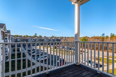 Balcony view overlooking the community parking area