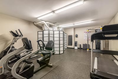 Interior view of a fitness room with exercise equipment