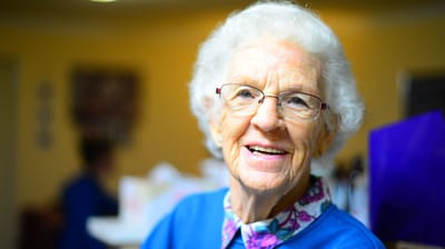 Smiling resident in a community setting