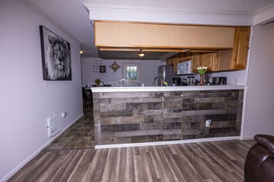 Bright interior kitchen area with wooden accents