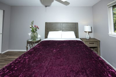 Private resident room with a bed and décor