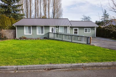Exterior view of a residential facility with green lawn