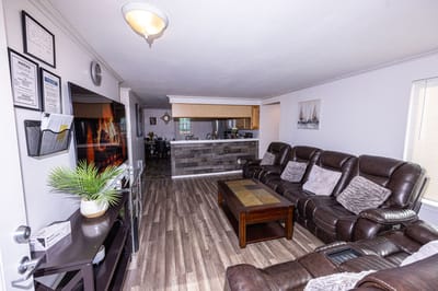 Cozy common area with comfortable seating and kitchen access
