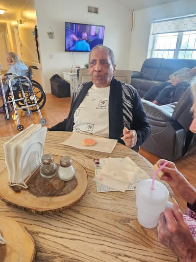 Residents enjoying snacks in a common area