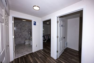 Interior shot of a hallway with resident rooms