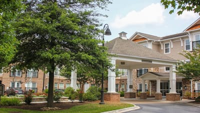 Entrance of a senior living facility with landscaping