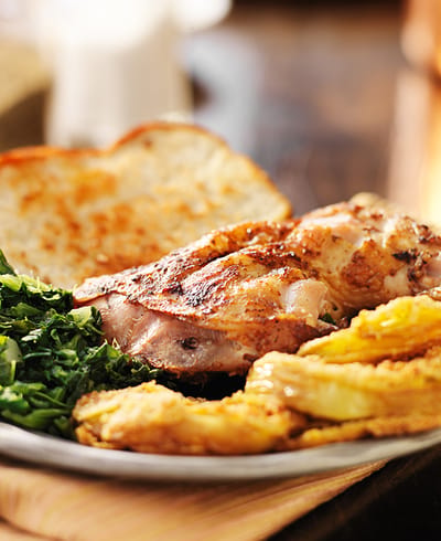 Delicious plate of grilled chicken with sides