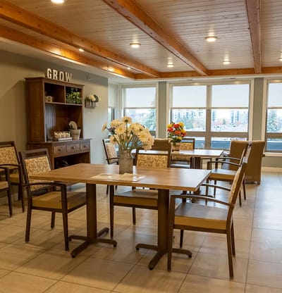 Common area with seating and flower arrangements