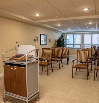 Interior view of a common area with chairs and a lectern