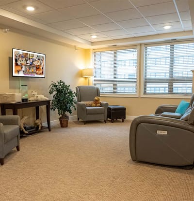 Cozy common area with comfortable seating and TV