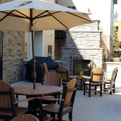 Outdoor seating area with umbrellas and stone decor