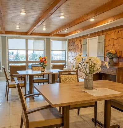 Bright common area with wooden ceiling and seating