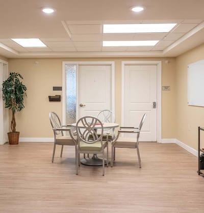 Bright common area with seating and tables