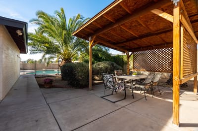 Outdoor shaded seating area with landscaping