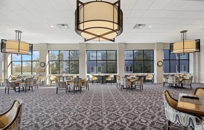Bright dining room with large windows and modern decor