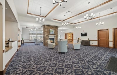 Interior common area with seating and a fireplace