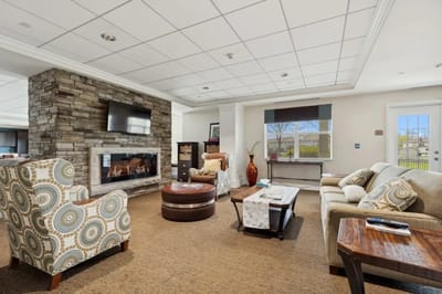 Cozy common area with seating and a fireplace