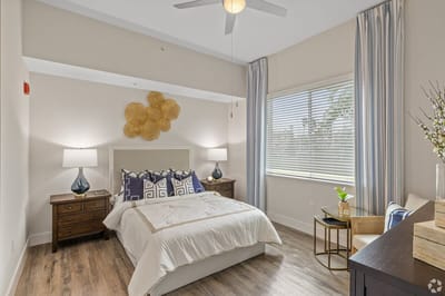 Brightly decorated private resident room with natural light