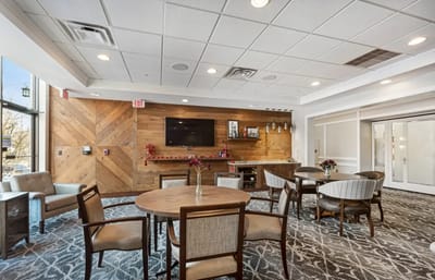 Bright common area with tables and chairs