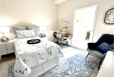 Bright and cozy resident bedroom with furnishings