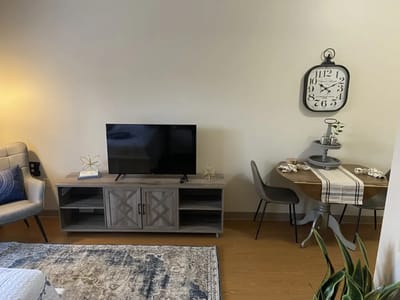 Cozy living space with a TV and dining table