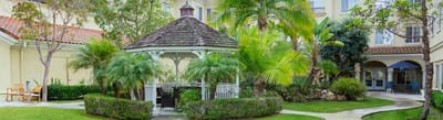 Beautiful garden area with gazebo and palm trees