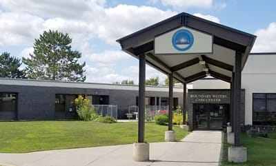 Front entrance of Boundary Waters Care Center with landscaping