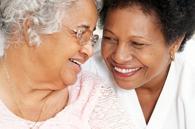 Benton House of Grayson, assisted living in Grayson, GA — Two women smiling and sharing a joyful moment