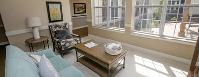 Bright common area with comfortable seating and natural light