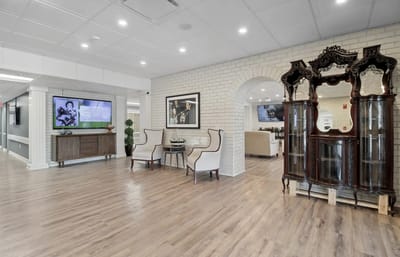 Bright common area with elegant furnishings and art