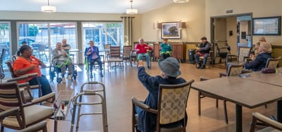 Residents participating in a group activity in a common area