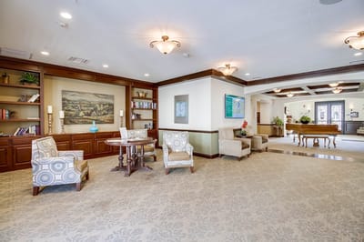 Comfortable common area with seating and bookshelves