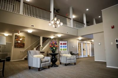 Common area with seating and floral display