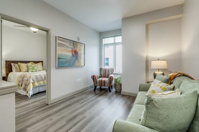 Bright interior of a resident room with seating area