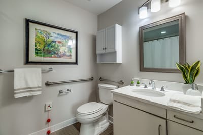 Well-lit bathroom with modern fixtures and decor