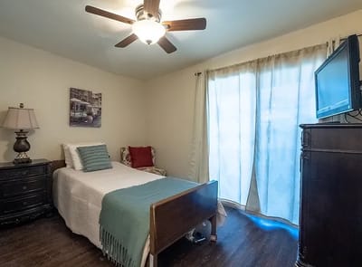 Cozy resident room with a bed and window