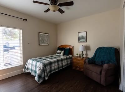Cozy bedroom with a bed and seating area