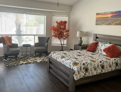 Bright, well-decorated resident room with natural light