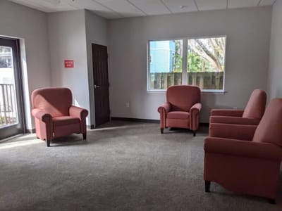 A common area with chairs in natural light
