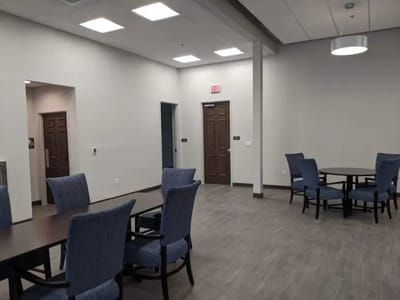 Interior view of a common area with tables and chairs