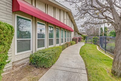 Pathway with landscaping around assisted living facility
