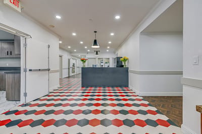 Interior view of a common area with colorful flooring