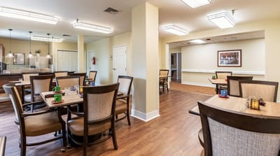 Interior view of a dining room with tables and chairs