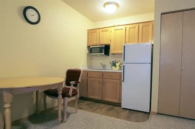 Cozy interior of a resident room with kitchenette