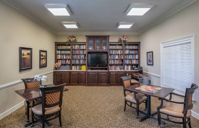 Interior of a cozy library or common area with bookshelves